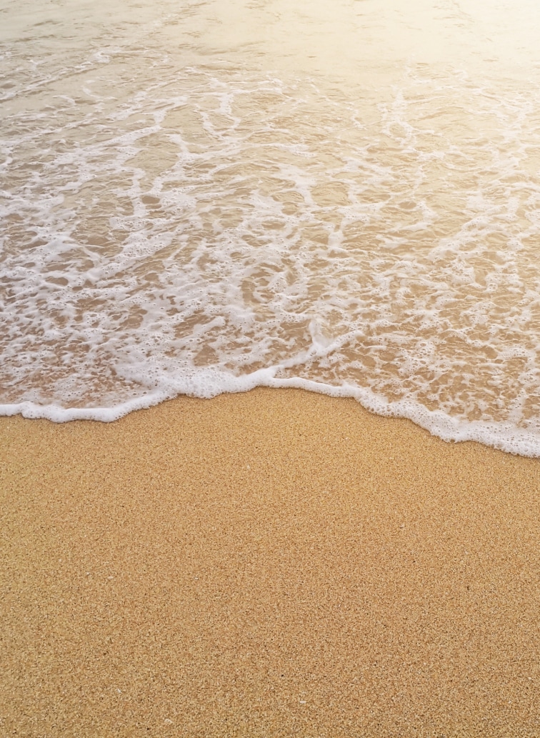 A stylish bedroom with a generous bed and a functional desk, blending comfort and modern design elements seamlessly.